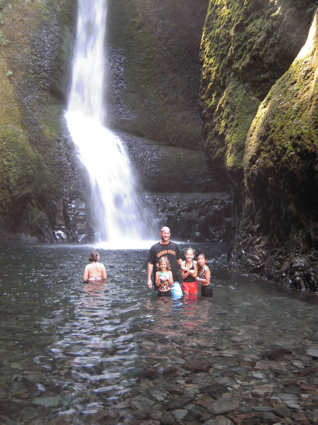 Little ones and Dad braving the cold Falls water.